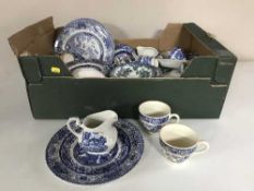 A tray and a box of 20th century blue and white china, tankards, cutlery,