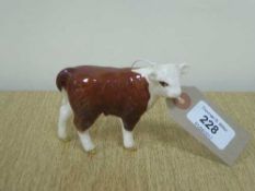 A Beswick figure - Hereford Calf, model 1827C, gloss.
