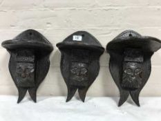 Three antique carved oak wall shelves