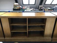 An early 20th century oak double sided library bookcase
