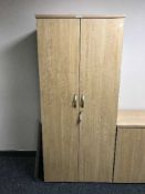 A double door office stationary cupboard,