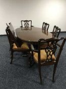 A reproduction dining table plus leaf and six Hepplewhite style chairs