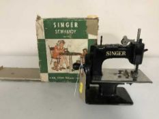 A miniature Singer sewhandy sewing machine No.