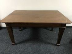 A late Victorian mahogany dining table