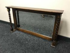 An oak overmantel mirror