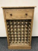 A reclaimed pine bottle rack fitted a drawer