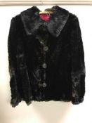 A vintage black fur coat - probably mink