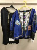 A full rail of theatre waistcoats,