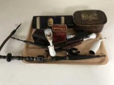A tray of vintage tins, bakelite money box,