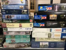 Eighteen boxed jigsaws