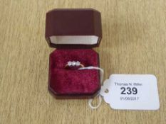 An 18ct gold three stone diamond ring