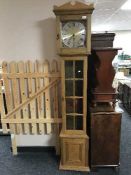 A continental oak long cased clock