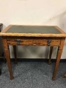 An Edwardian oak side table