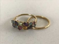 An 18ct gold band ring together with a 9ct gold dress ring