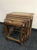 A nest of four Eastern hardwood tables