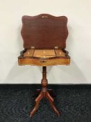 A mahogany pedestal work table