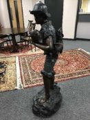 An impressive bronze fountain statue of a boy fishing