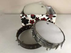 A box of banjo skins and frames, strings,