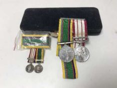 Two cadet forces medals with ribbons together with accompanying miniature medals