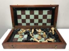 A nineteenth century mahogany cased chess set with pieces