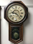 A late Victorian American Regulator clock with pendulum