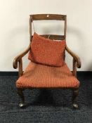 A rosewood armchair on Queen Anne style legs