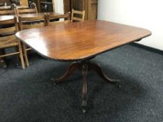 A Regency mahogany tilt-top breakfast table, on a turned four-way pedestal support,