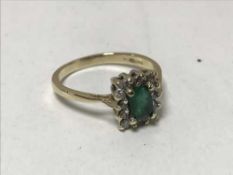 A 9ct gold emerald and diamond cluster ring, 2.