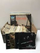 Two crates containing LP's and 45's including Jazz, Musicals etc, Louis Armstrong, County Basi,