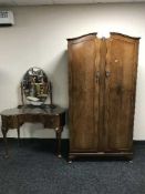 A two piece walnut bedroom suite comprising of Gentleman's wardrobe and kidney shaped dressing
