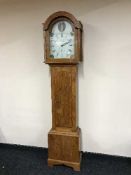 An oak longcased clock signed M Hollett of Alfreton with painted dial