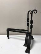 A pair of cast metal fire dogs