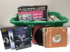 A box of lps, 45's and dvds including Burlives, Joe Jones,