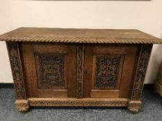 A carved oak buffet sideboard