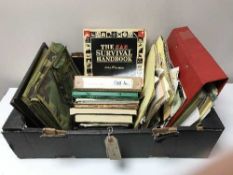 A box of military photographs and ephemera including survival hand books,