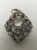 A superb quality diamond pendant/brooch in original Carrington's box,