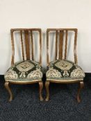 A pair of Victorian oak spoon backed dining chairs