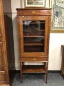 An Edwardian inlaid mahogany display cabinet