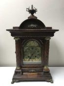 A nineteenth century oak bracket clock with brass dial