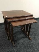 A nest of three mahogany G-plan tables