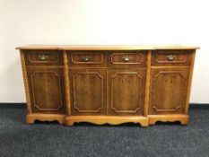 A yewwood breakfronted sideboard