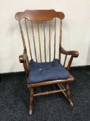 A stained beech rocking chair
