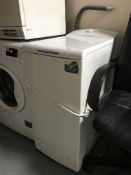 A whirlpool slimline top loading washing machine