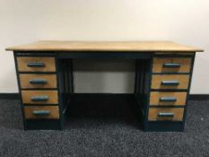 An mid twentieth century oak painted twin pedestal desk