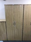 A double door office stationary cupboard