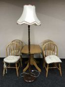 A contemporary drop leaf kitchen table and four chairs,