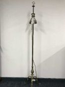 An early twentieth century brass two-way lamp