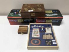 A tray containing two Texas Holdem Poker sets together,