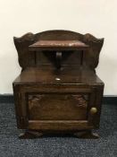 A continental oak marble topped bedside stand