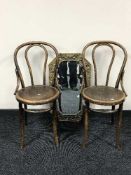A hexagonal brass framed bevelled mirror together with a pair of bentwood chairs